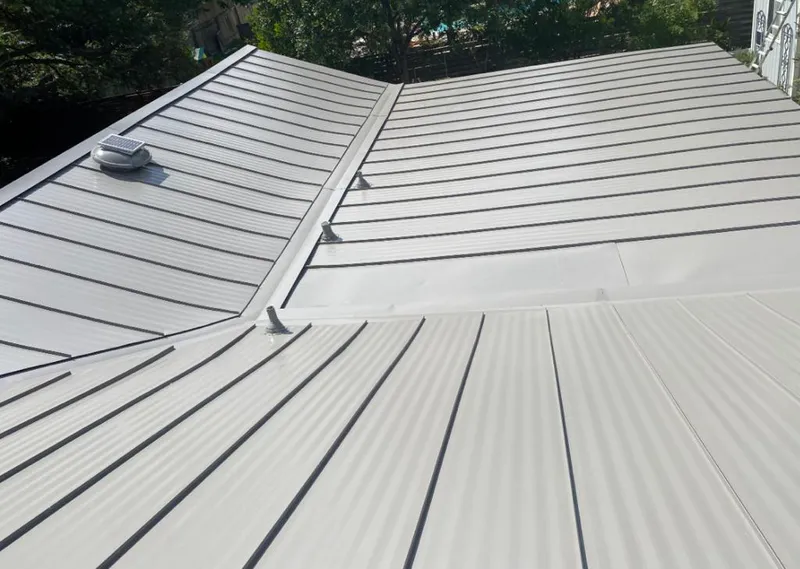 Solar attic fan installed on a metal roof for Roof Ventilation in La Vista